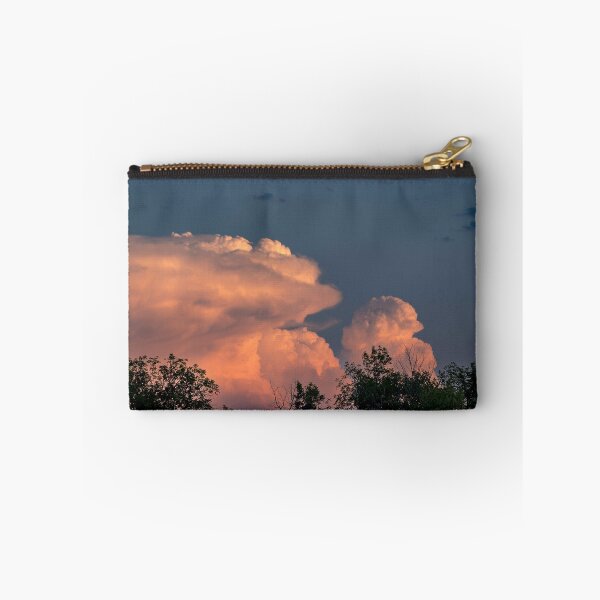 Item preview, Salmon pink cumulonimbus clouds at sunset with trees in foreground designed and sold by lisavonbiela.