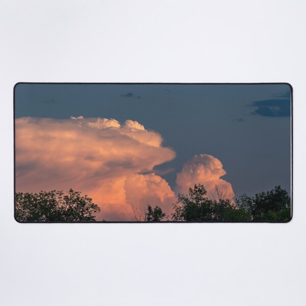 Item preview, Salmon pink cumulonimbus clouds at sunset with trees in foreground designed and sold by lisavonbiela.
