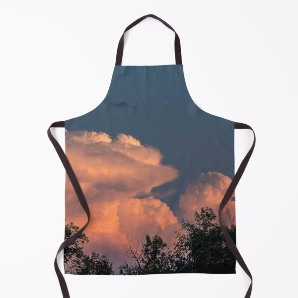 Item preview, Salmon pink cumulonimbus clouds at sunset with trees in foreground designed and sold by lisavonbiela.