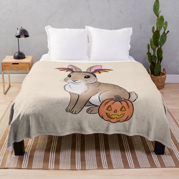 Item preview, Cottontail Rabbit in Bat Costume Sticker, Texas Wildlife Halloween Art designed and sold by Ink & Kind Studio.