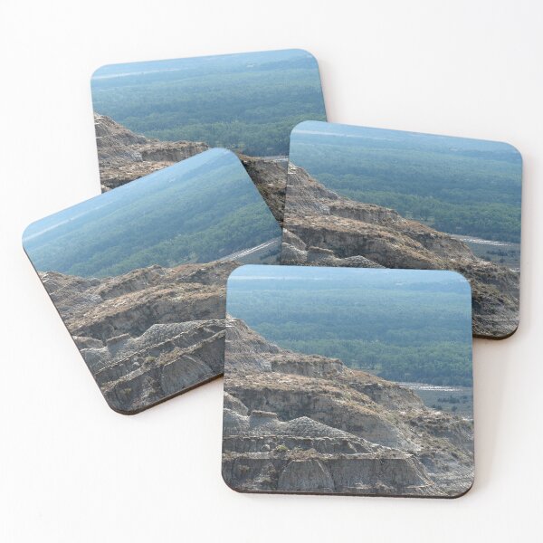 Item preview, Badland formation at Theodore Roosevelt National Park with trees in the distance designed and sold by lisavonbiela.