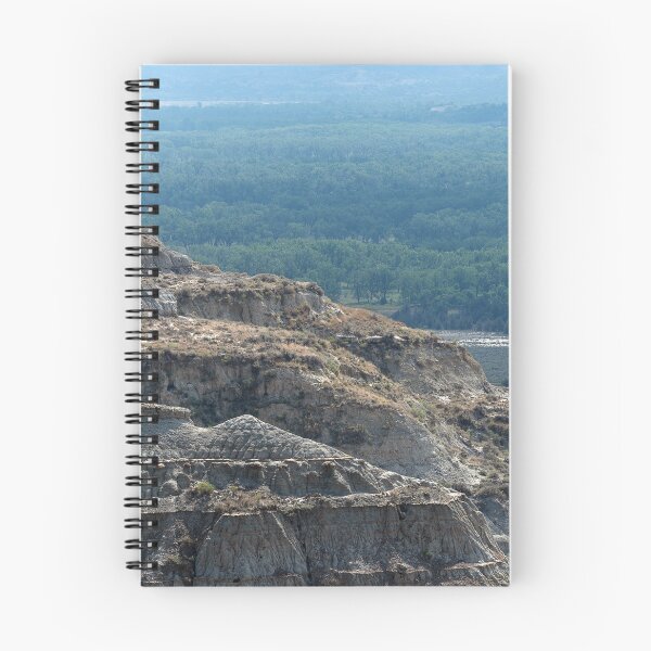 Item preview, Badland formation at Theodore Roosevelt National Park with trees in the distance designed and sold by lisavonbiela.