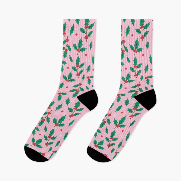 Item preview, green holly twigs, red berries and white snowflakes on pastel pink background.  designed and sold by burbura.