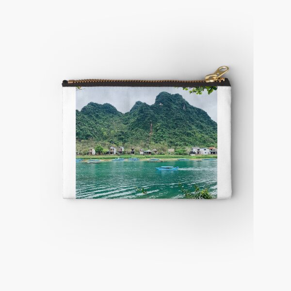 Item preview, Turquoise River Boat View With Lush Karst Mountain Backdrop designed and sold by felachrata.