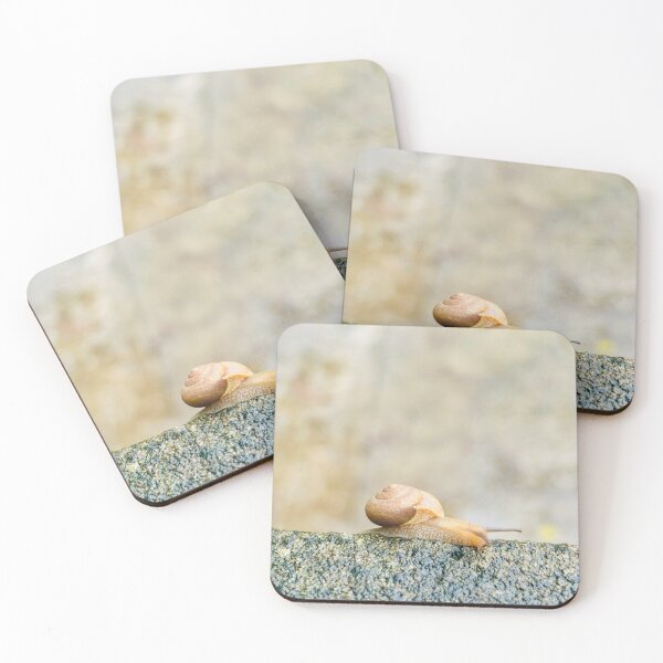 Item preview, Curious Little Snail Reaching Along Weathered Stone Ledge - Soft Bokeh Nature Art designed and sold by ambepeep.