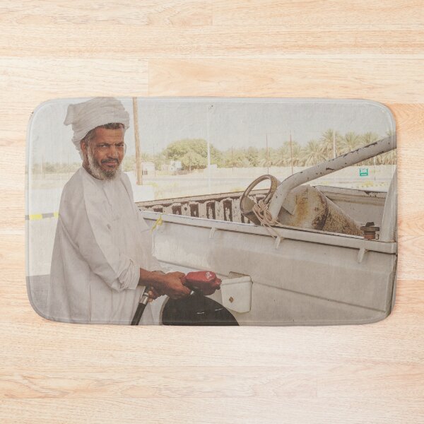 Item preview, Man in Oman filling up car at gas station designed and sold by Photopat.