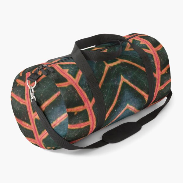 Item preview, Dark green plant with orange-red veins, mirror image designed and sold by lyloubeaupere.
