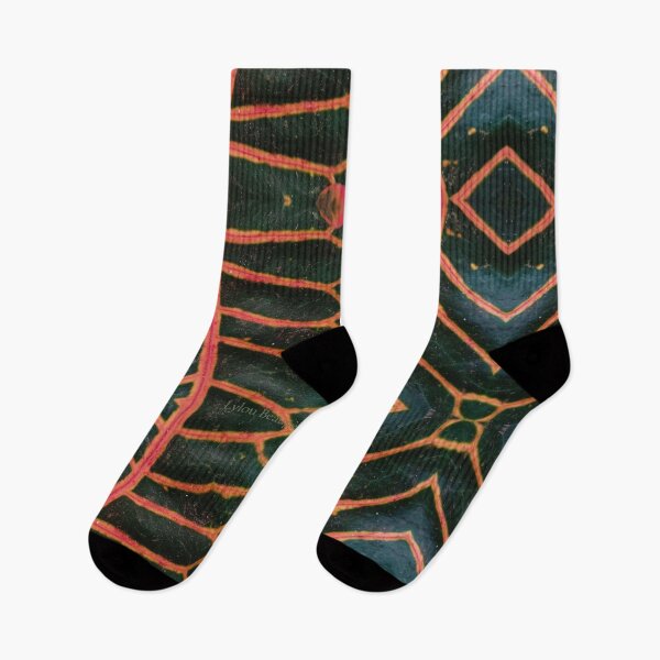 Item preview, Dark green plant with orange-red veins, mirror image designed and sold by lyloubeaupere.