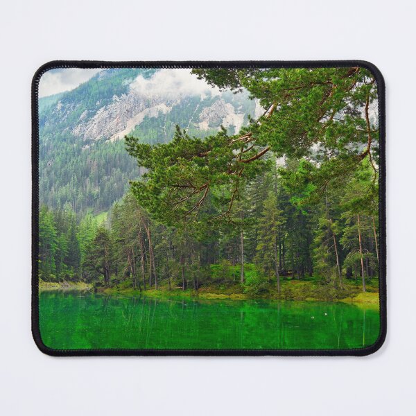 Item preview, Vibrant emerald green water of Grüner See lake in Styria Austria with pine forest and mountains designed and sold by goceris.
