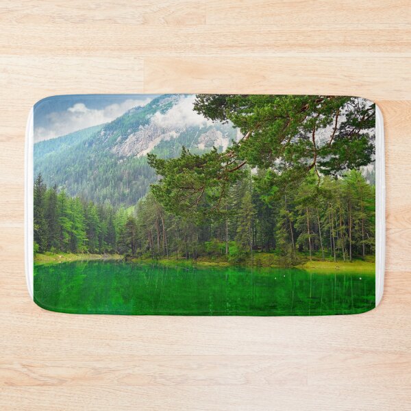 Item preview, Vibrant emerald green water of Grüner See lake in Styria Austria with pine forest and mountains designed and sold by goceris.