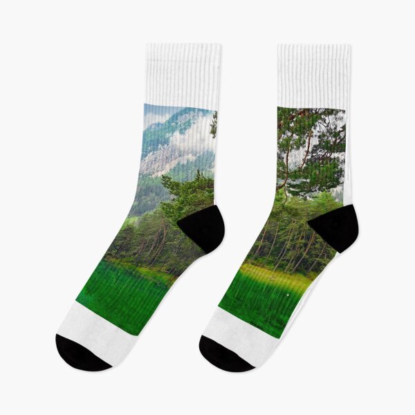 Item preview, Vibrant emerald green water of Grüner See lake in Styria Austria with pine forest and mountains designed and sold by goceris.