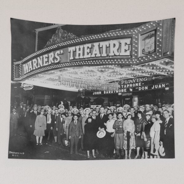 Item preview, Hollywood first-nighters posing for the camera outside the Warners' Theater before the premiere of "Don Juan" with John Barrymore vintage black and white photograph designed and sold by Astrid Arkhangelsky.