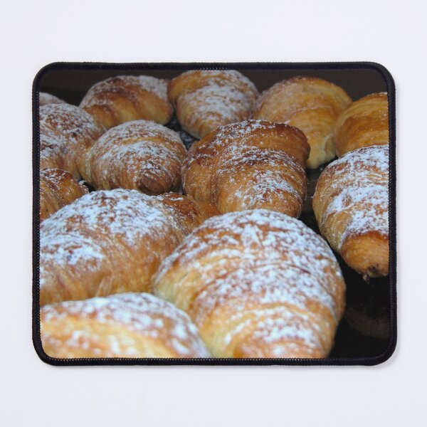 Item preview, Italian croissants sprinkled with icing sugar on a shiny black surface, background. designed and sold by ollgast5.