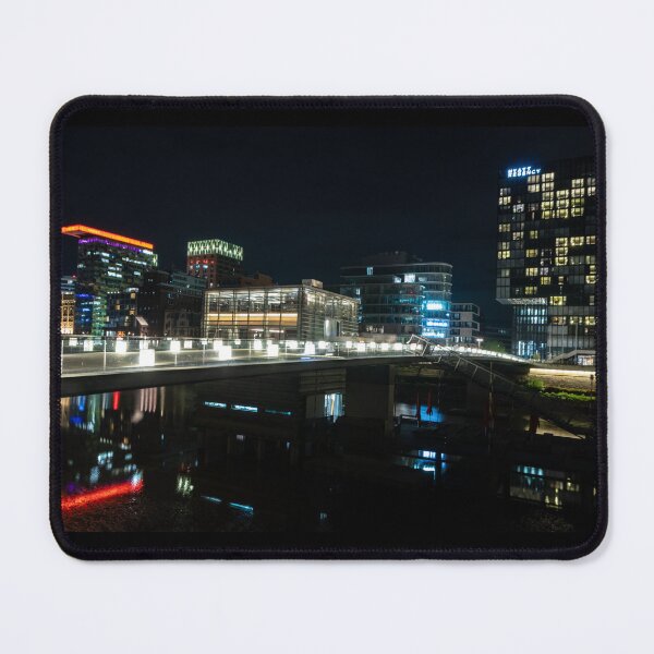 Item preview, Düsseldorf Media Harbour at night with light bridge and reflection of the city lights designed and sold by Your Happy Life.