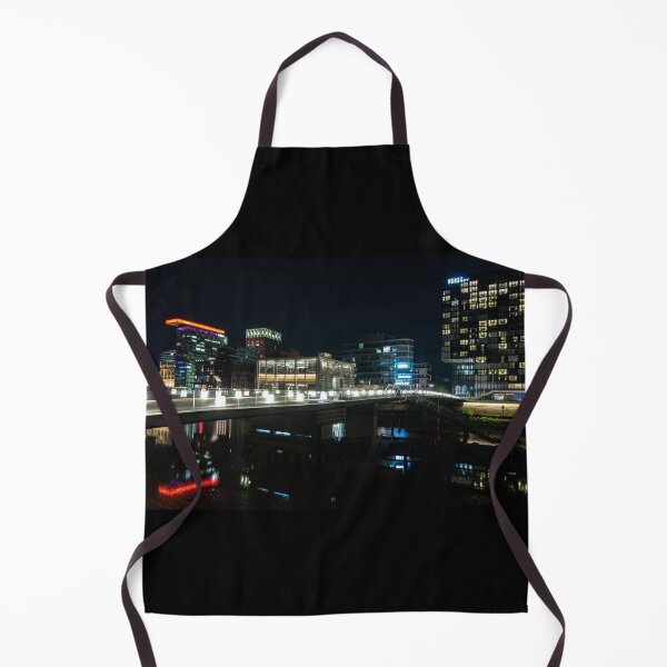 Item preview, Düsseldorf Media Harbour at night with light bridge and reflection of the city lights designed and sold by Your Happy Life.