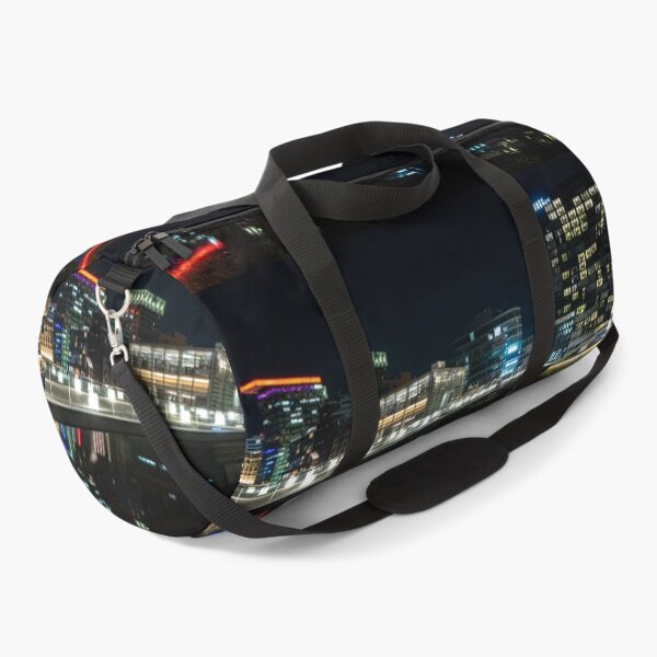 Item preview, Düsseldorf Media Harbour at night with light bridge and reflection of the city lights designed and sold by Your Happy Life.