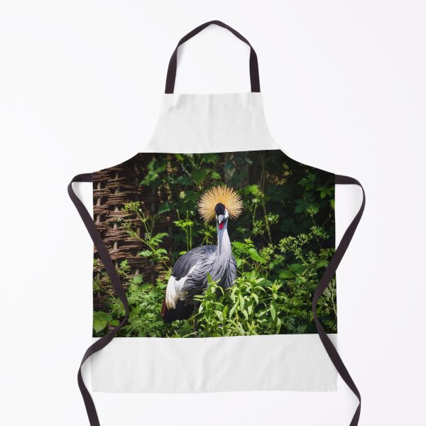 Item preview, Crowned Majesty. Grey Crowned Crane Amid Lush Green Foliage designed and sold by Astute-Artio-Photography.