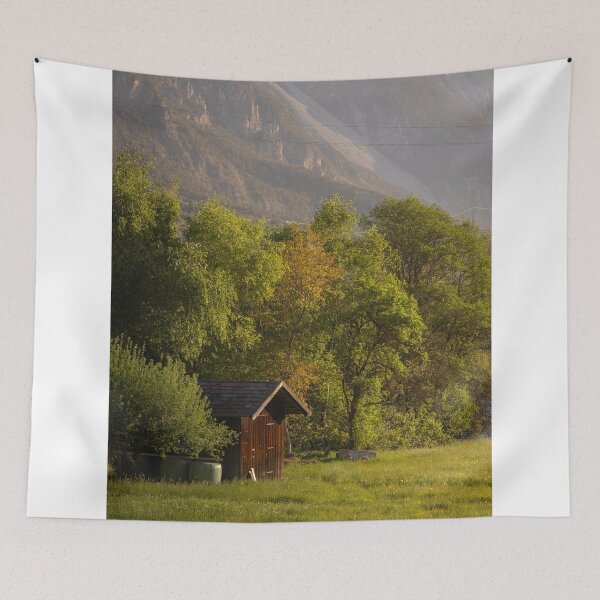 Item preview, Wooden Cabin In Meadow Near Mountain Slope At Sunset designed and sold by Mylieton.