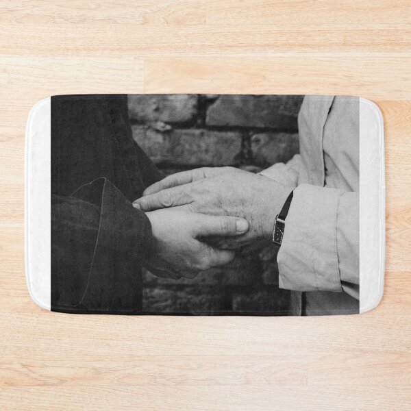 Item preview, Close Up Of Two People Holding Hands Against Brick Wall designed and sold by Kylodt.