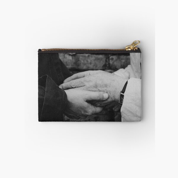 Item preview, Close Up Of Two People Holding Hands Against Brick Wall designed and sold by Kylodt.