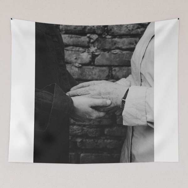Item preview, Close Up Of Two People Holding Hands Against Brick Wall designed and sold by Kylodt.