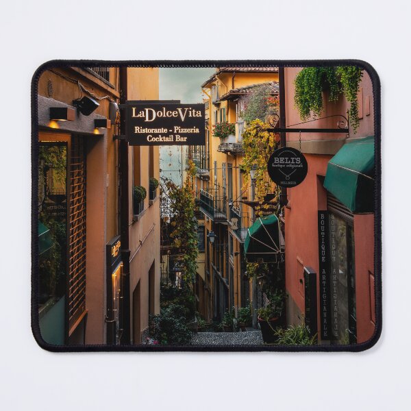 Item preview, Narrow Cobblestone Alley With Restaurant Signs In Italian Town designed and sold by Maveryc.