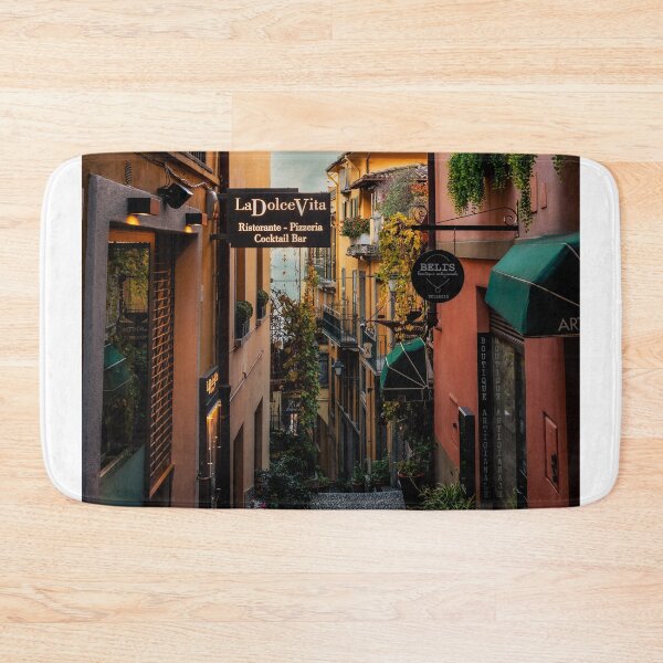 Item preview, Narrow Cobblestone Alley With Restaurant Signs In Italian Town designed and sold by Maveryc.