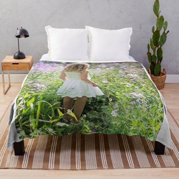 Item preview, Little Girl In White Dress Walking Through Wildflower Meadow designed and sold by Maveryc.