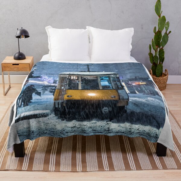 Item preview, Classic Yellow Tram Navigating Through Heavy Snowstorm In City designed and sold by Francisera.