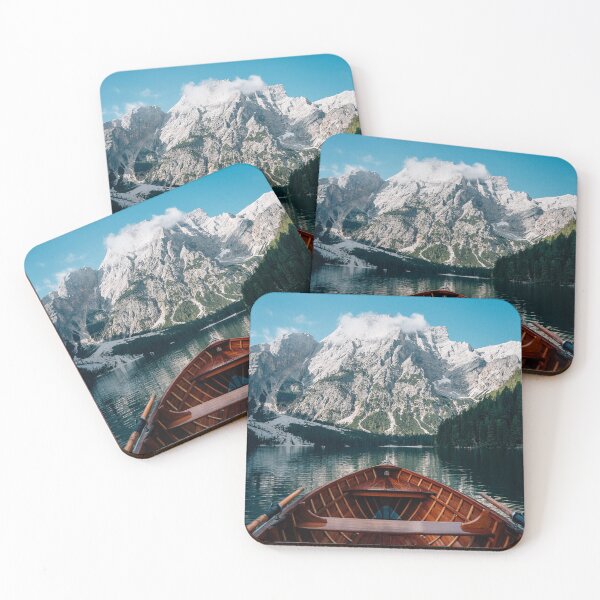 Item preview, Bote de remos de madera en un lago de aguas cristalinas con vistas a imponentes picos montañosos. designed and sold by Russone.