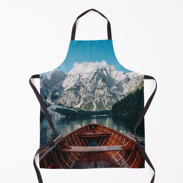 Item preview, Bote de remos de madera en un lago de aguas cristalinas con vistas a imponentes picos montañosos. designed and sold by Russone.