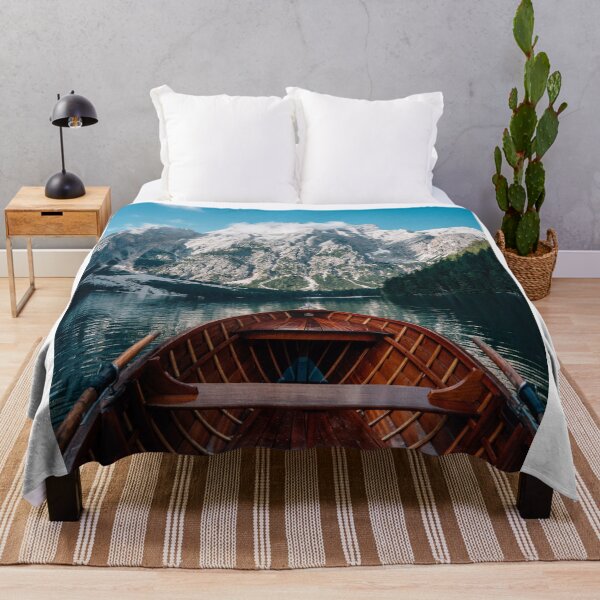 Item preview, Wooden Rowboat On Crystal Clear Lake Facing Towering Mountain Peaks    designed and sold by Russone.