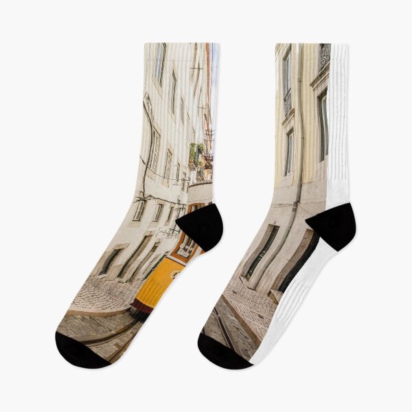 Item preview, Yellow Vintage Tram Ascending Steep Cobblestone Street In Lisbon designed and sold by Laughline.