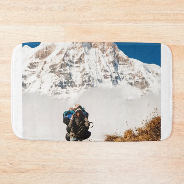 Item preview, Porter Carrying Heavy Backpack Ahead Of Snow Covered Mountain Peak designed and sold by Laughline.