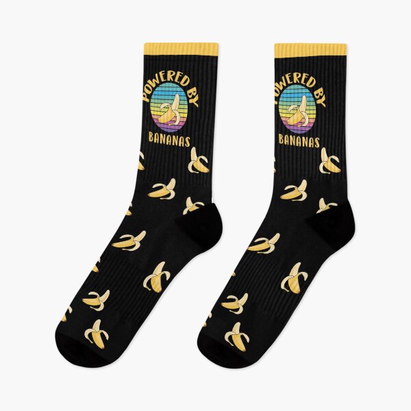 Item preview, Powered by bananas, with colorful retro-style circular background and a banana designed and sold by Sock Garden.