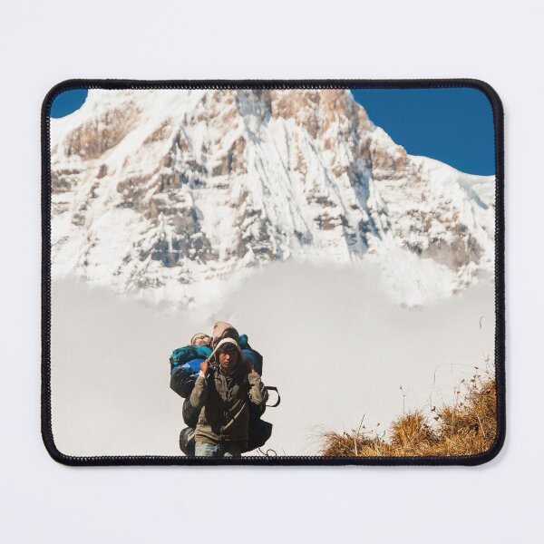 Item preview, Porter Carrying Heavy Backpack Ahead Of Snow Covered Mountain Peak designed and sold by Matricko.