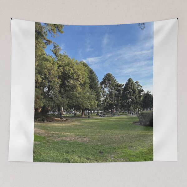 Item preview, Spacious Green Lawn Surrounded By Lush Trees In Urban Park designed and sold by Hutchingse.