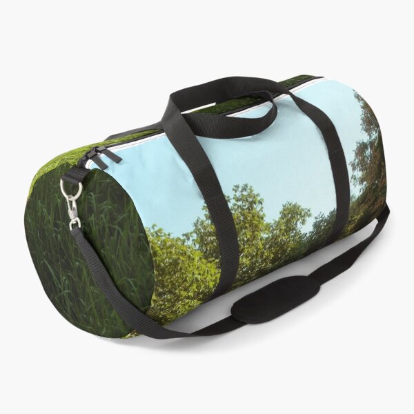 Item preview, Sunlit Grassy Slope Beside Tree-Lined Pathway designed and sold by Squikale.