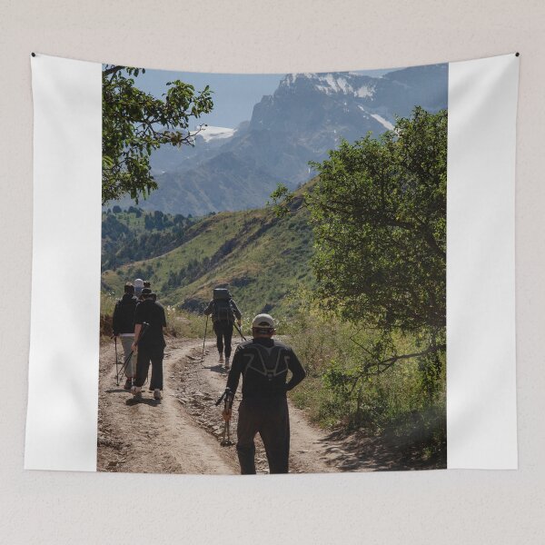 Item preview, Hikers Walking On Mountain Trail Toward Snow Peaks designed and sold by Ayubaslatere.
