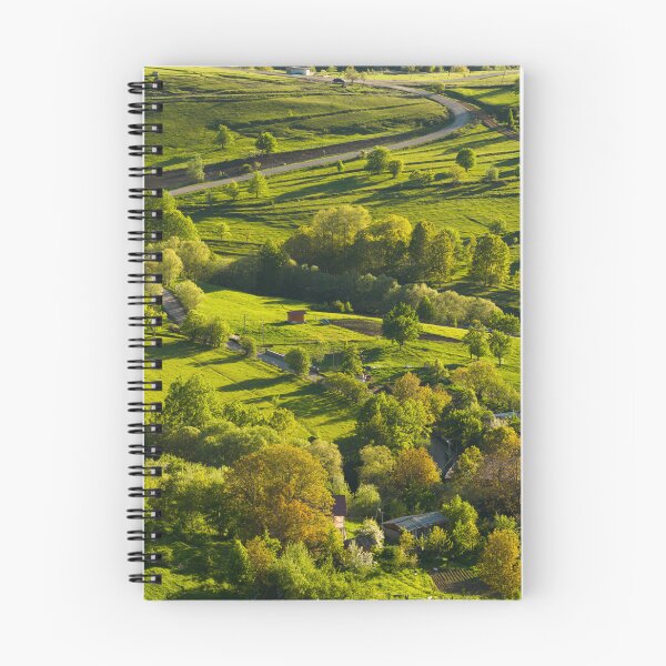 Item preview, Aerial View Of Sunlit Countryside Village And Road designed and sold by Ayubaslatere.