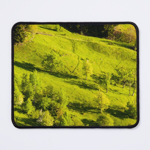 Item preview, Sunlit Green Hillside Bordered By Dense Forest designed and sold by Ayubaslatere.