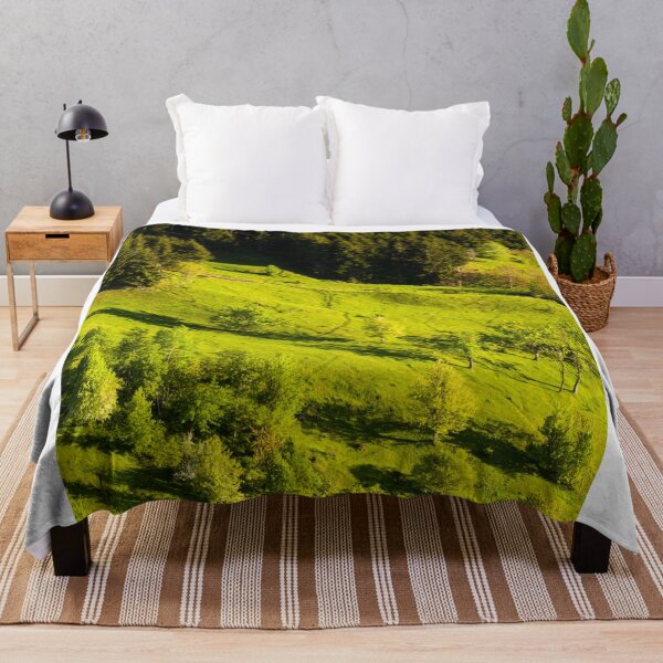Item preview, Sunlit Green Hillside Bordered By Dense Forest designed and sold by Ayubaslatere.