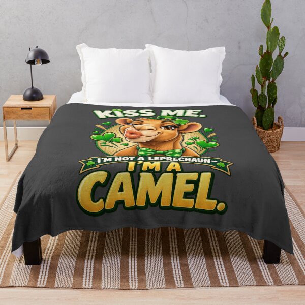 Item preview, Kiss Me I'm a Camel - surrounded by shamrocks in this bold and humorous St Patrick's Day design – Funny Irish St. Patrick's Day Graphic T-Shirt designed and sold by Camel & Quirk.