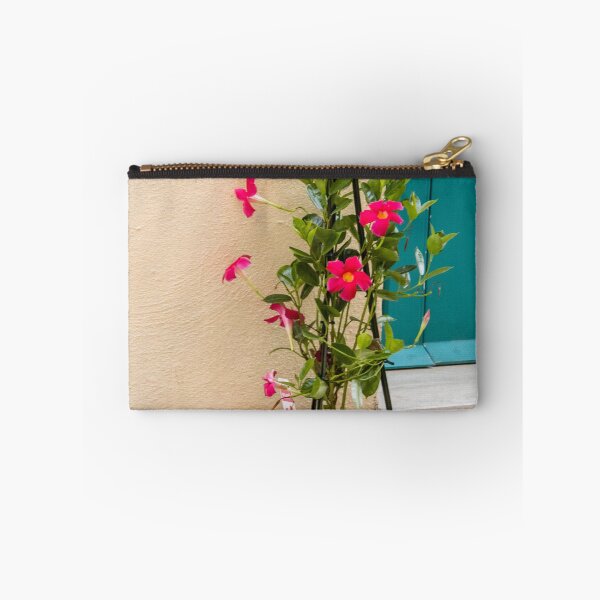 Item preview, Potted Pink Mandevilla Vine With Bright Flowers Beside Teal Door On Stucco Wall designed and sold by Nmallia.