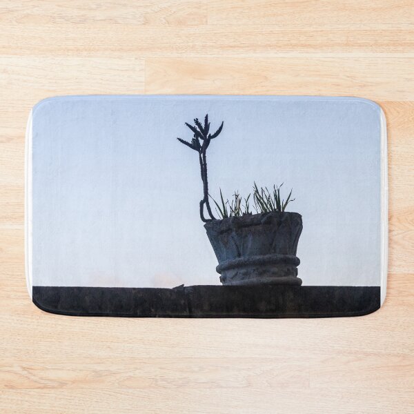 Item preview, Silhouetted Potted Cactus On A Weathered Pot At Dusk On Rooftop Wall designed and sold by Nmallia.