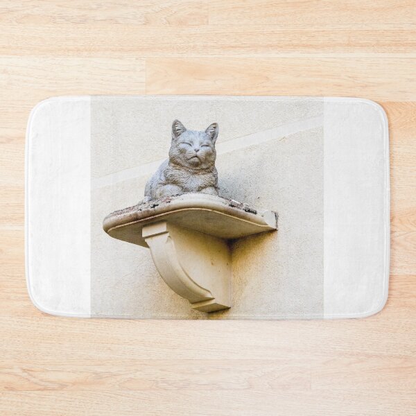 Item preview, Stone Cat Statue on Decorative Wall Shelf Against Textured Beige Stucco Wall designed and sold by Nmallia.