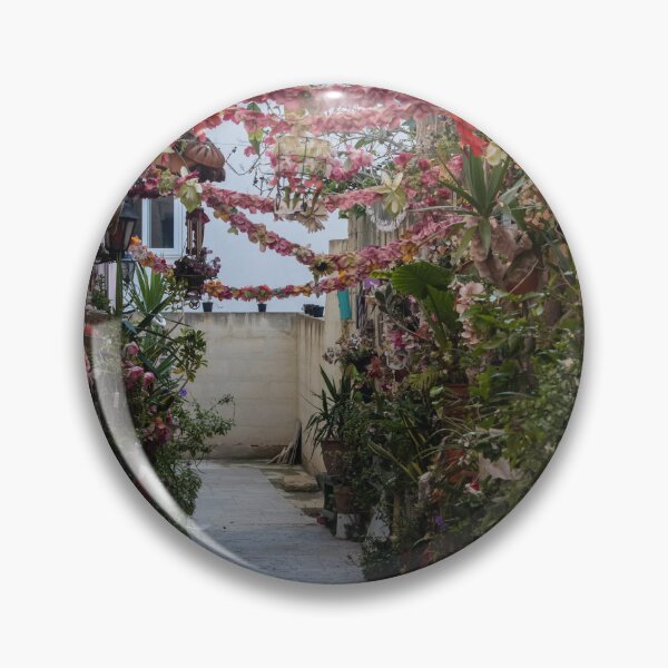 Item preview, Flower-Decked Narrow Alleyway With Hanging Pink Garlands And Lush Potted Plants designed and sold by Nmallia.