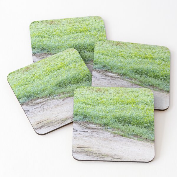Item preview, Dewy Grass Beside Muddy Dirt Road With Tire Tracks and Green Field in Morning Light designed and sold by Nmallia.