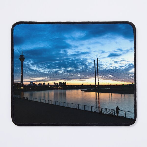 Item preview, Düsseldorf skyline at sunset with sun reflection and clouds. designed and sold by Your Happy Life.
