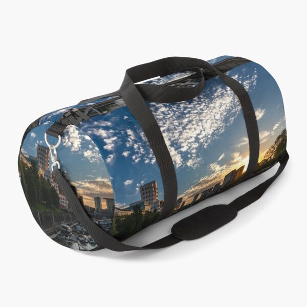 Item preview, Düsseldorf Media Harbour at sunset with sun reflection and small clouds designed and sold by Your Happy Life.
